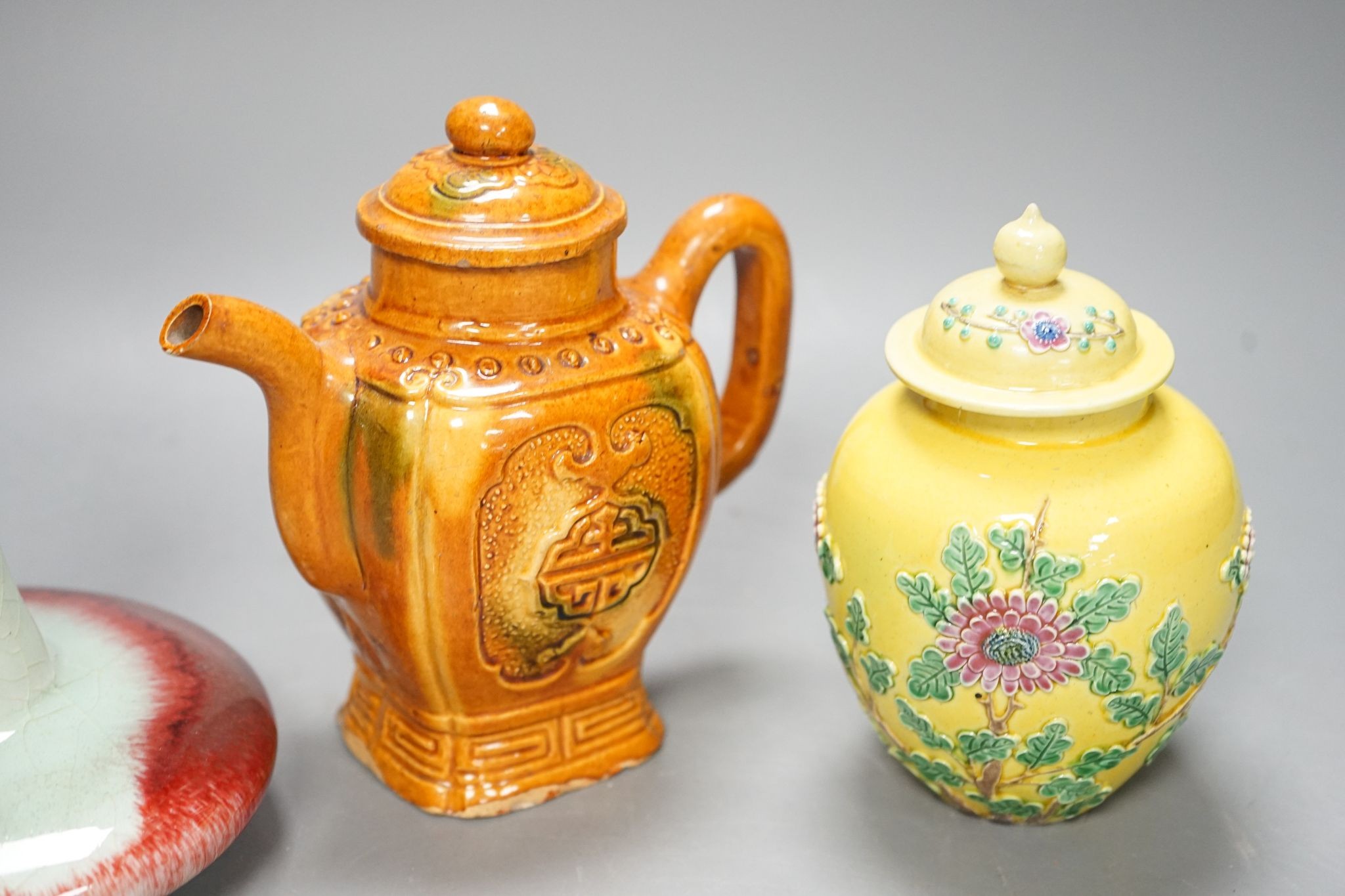 A Chinese enamelled yellow-ground jar and cover, a pottery teapot and cover and a flambe vase, latter 13cm